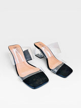 Tamanco Lisboa Black Beyou Shoes com tiras transparentes, palmilha preta e salto bloco transparente de 7,5 cm.